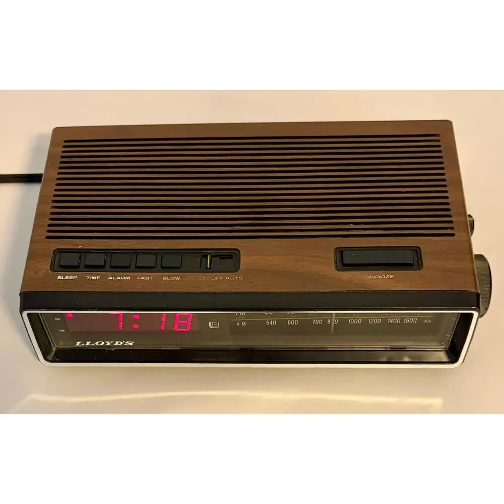 Vintage Lloyds Model J274A Clock Radio Simulated Wood Grain Plastic- clock only